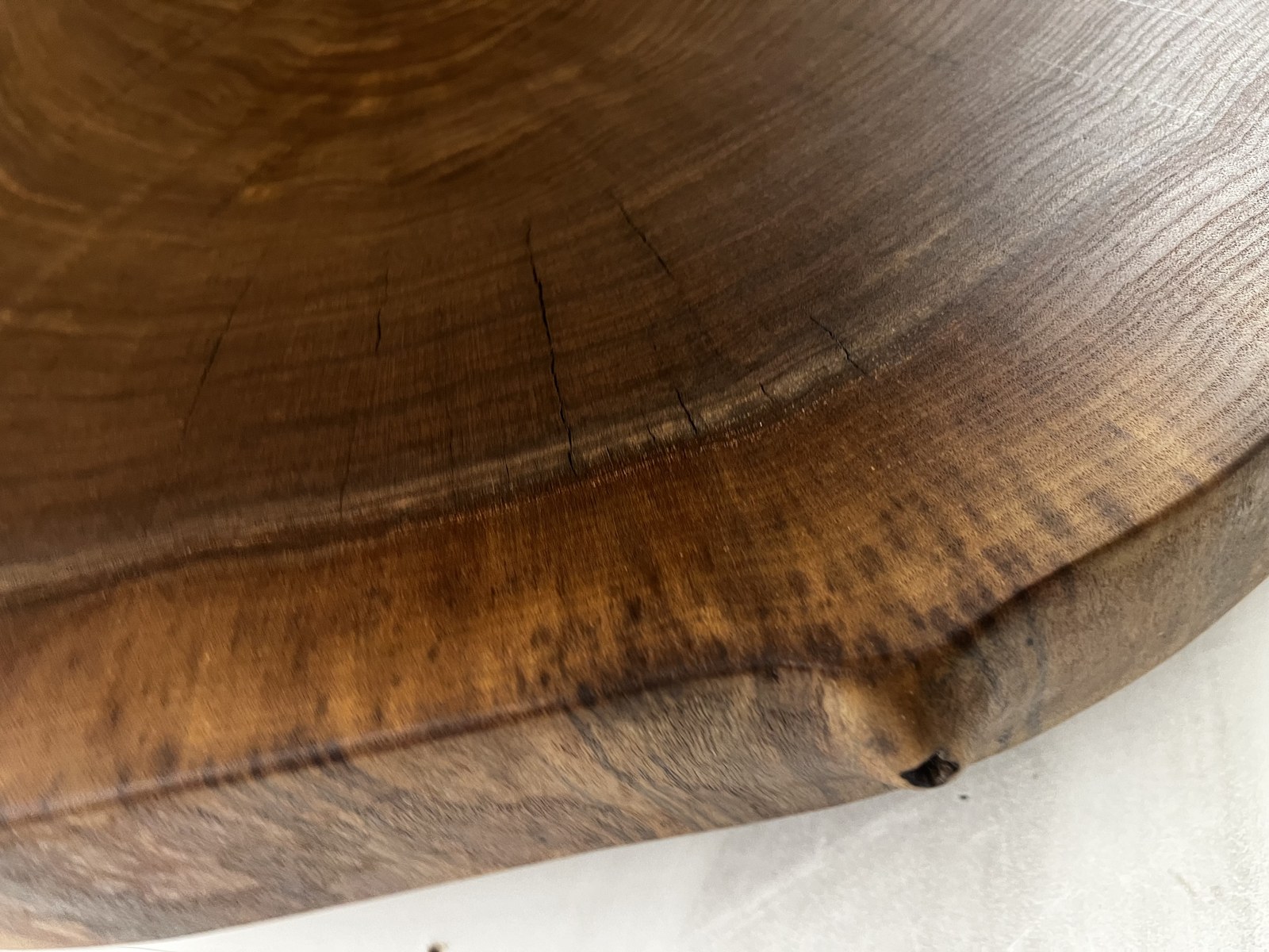 Close-up of the grain and natural edge of a finished wooden slab